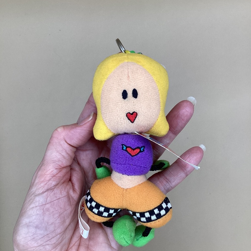 Vintage plush doll backpack clip